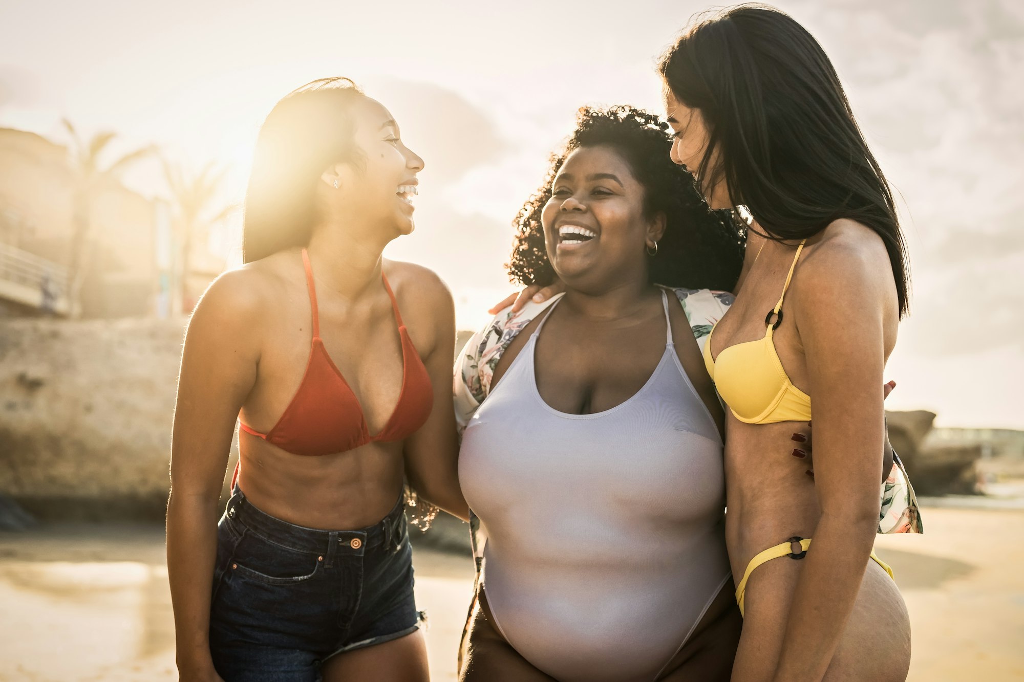 smiling friends on a beach